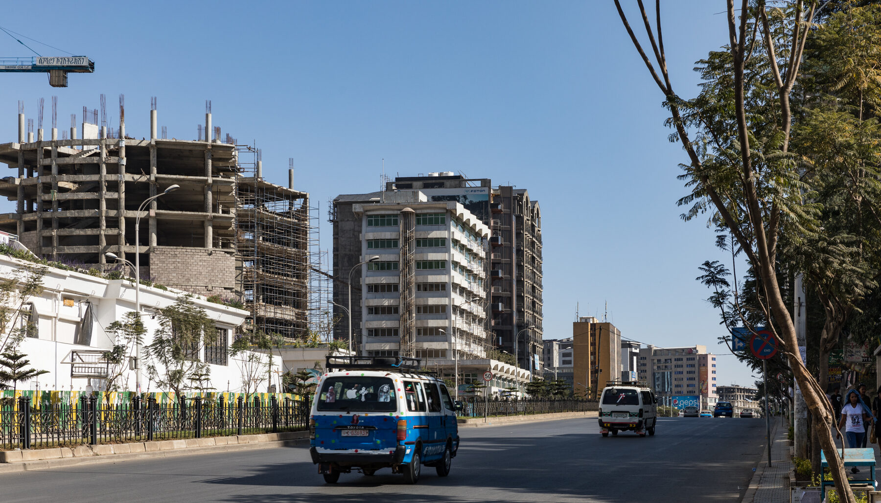 Addis Ababa city center skyline with mid-rise buildings and roads.